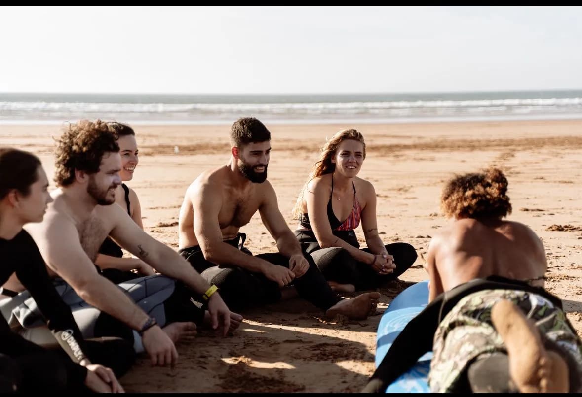 Smaylo instructor teaching surf technique on the sand